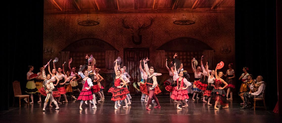 Don Quixote ensemble hold flamenco dance pose with fans Frankston Arts Centre