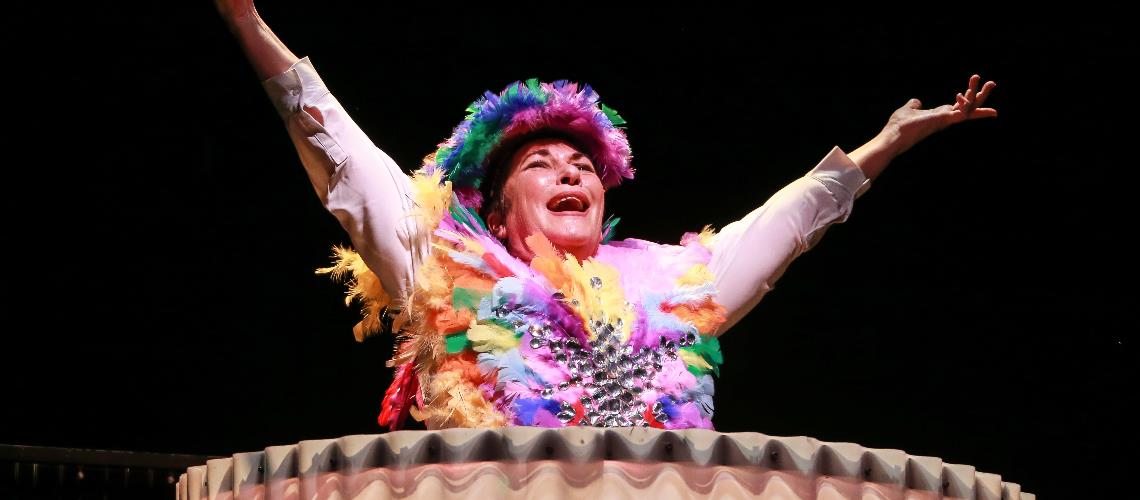 Rovers lady with colourful costume with arms outstretched Frankston Arts Centre