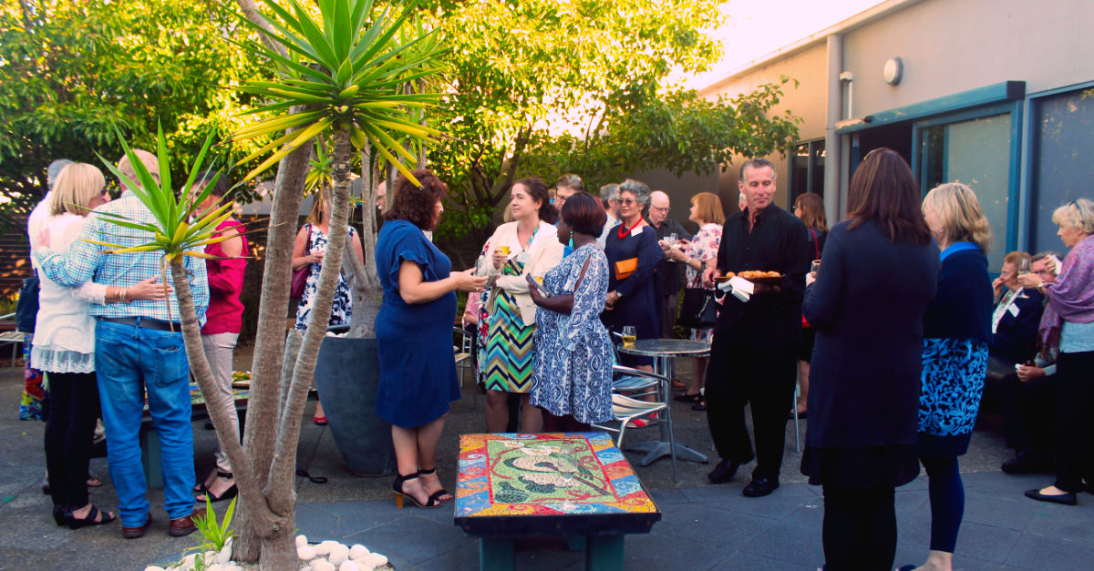 Guests enjoying refreshments in the courtyard at Cube 37 Frankston Arts Centre