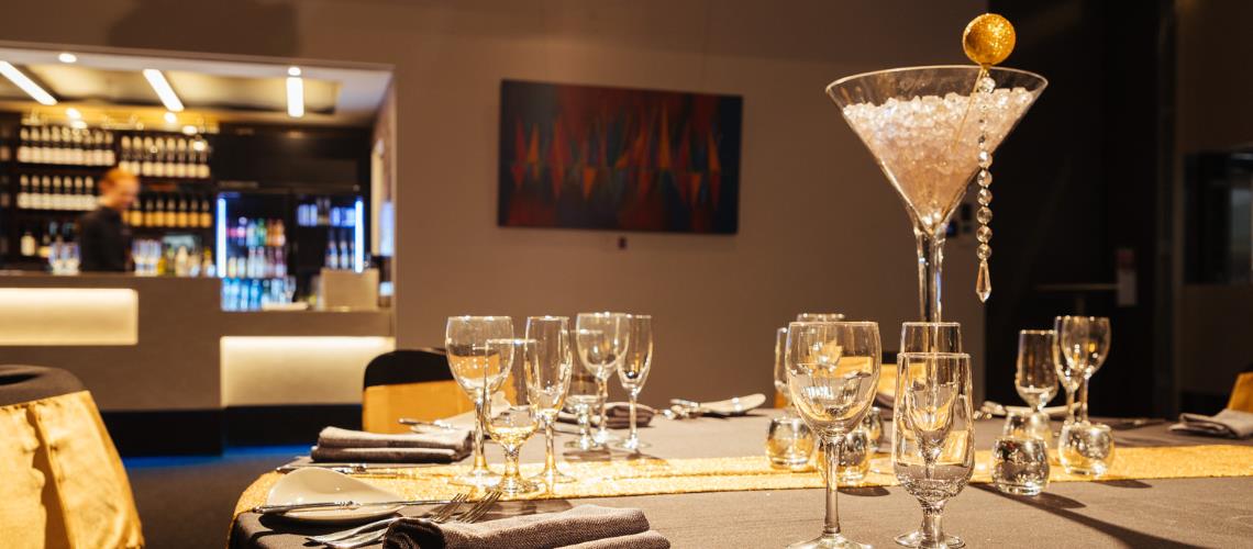 Function Room table setting with bar in the background at Frankston Arts Centre